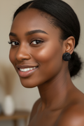 Black woman wearing Midnight Willow Botanical Stud Earrings lifestyle photo